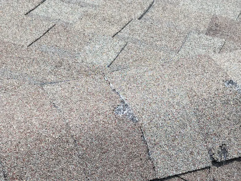 Cracked shingle from storm