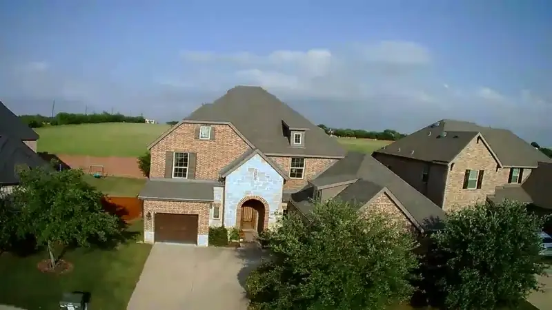 Aerial view of homes and new roofs in Collin County, TX