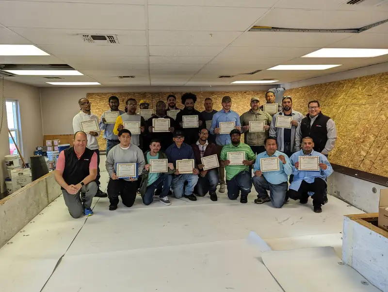 Roofing crew with certificates from GAF Roofing Academy training