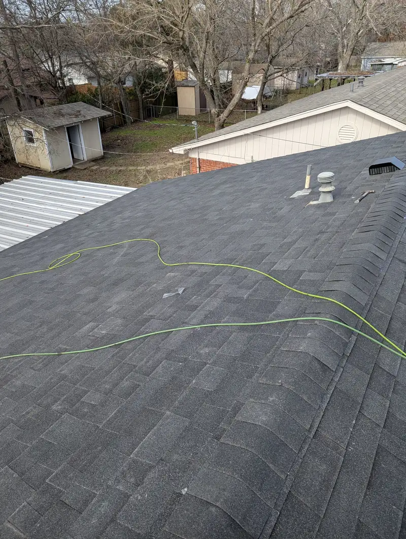 Finished roof and gutters on a North Texas home